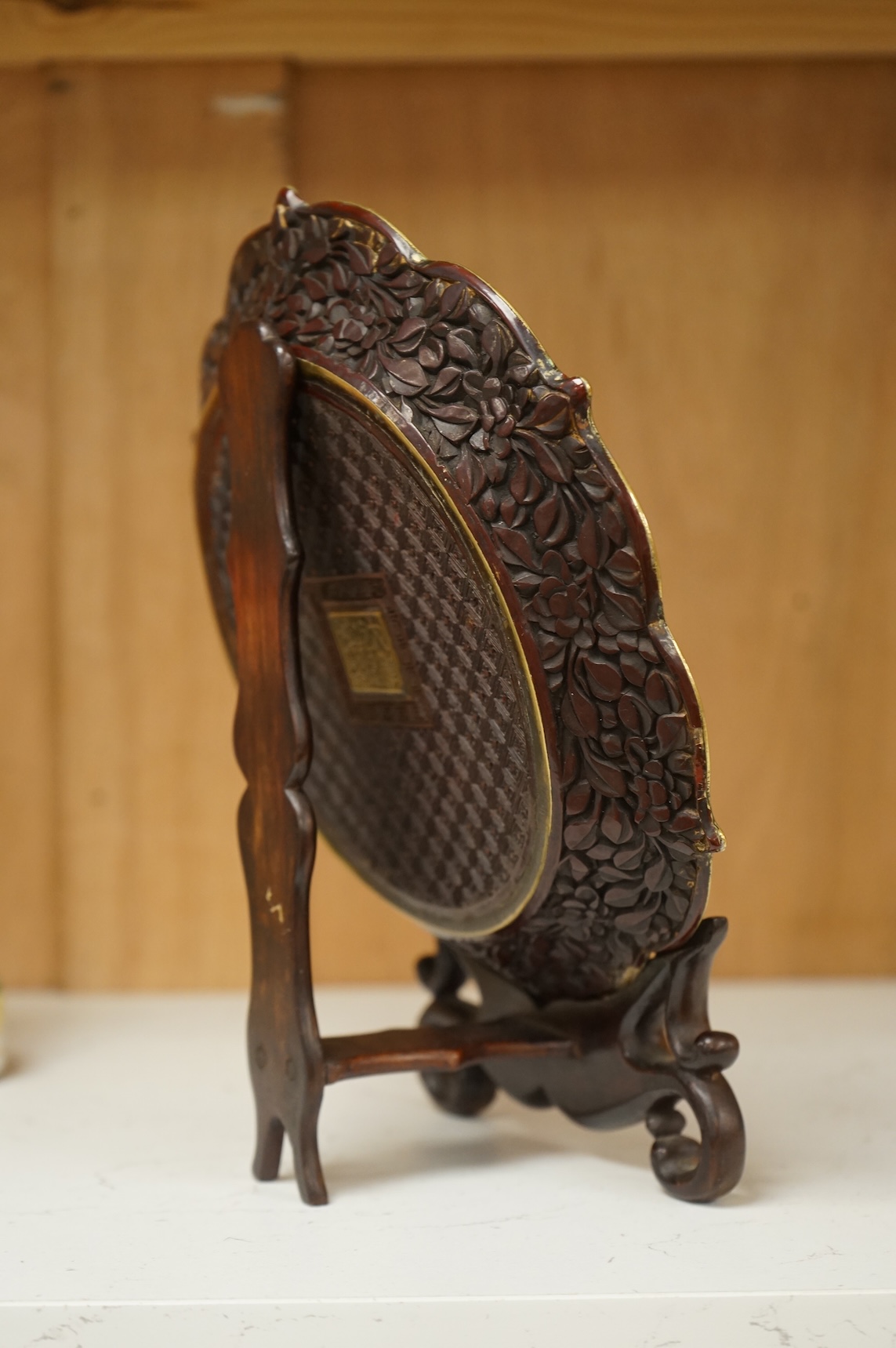 A Chinese lacquer foliate-shaped dish on stand, 18cm in diameter